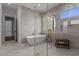Bathroom with freestanding tub and frameless glass shower at 4912 Hidden Pasture Way, Zebulon, NC 27597