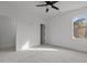 Spacious bedroom with a ceiling fan, carpet, and a well-lit window at 4912 Hidden Pasture Way, Zebulon, NC 27597