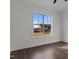Bright room featuring a large window with a view of the surrounding area at 4912 Hidden Pasture Way, Zebulon, NC 27597