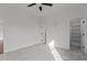 Bright bedroom with neutral carpet and two doorways, one leading to a closet at 4912 Hidden Pasture Way, Zebulon, NC 27597