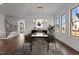Formal dining room with natural light and hardwood floors at 4912 Hidden Pasture Way, Zebulon, NC 27597