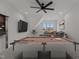 Finished game room with a billiard table, entertainment center, and seating area at 4912 Hidden Pasture Way, Zebulon, NC 27597
