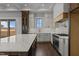 Well-lit kitchen featuring stainless steel appliances, white cabinets, and a large island at 4912 Hidden Pasture Way, Zebulon, NC 27597