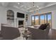 Cozy living room with fireplace, recessed lighting, and a sliding glass door to a deck at 4912 Hidden Pasture Way, Zebulon, NC 27597