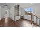 The loft features a built-in desk area, complemented by hardwood floors at 4912 Hidden Pasture Way, Zebulon, NC 27597