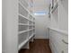 Walk-in closet with custom built-in shelving and drawers at 4912 Hidden Pasture Way, Zebulon, NC 27597