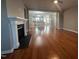 Open concept living room with hardwood floors and fireplace at 4972 Highcroft Dr, Cary, NC 27519