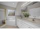 Elegant bathroom with double vanity, soaking tub, and shower at 506 Kellyridge Dr, Apex, NC 27502