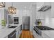 Modern kitchen with stainless steel appliances and white cabinets at 506 Kellyridge Dr, Apex, NC 27502