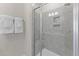 Bathroom with walk-in shower and gray tile at 600 Market Grove Dr # 200, Wake Forest, NC 27587