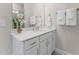 Bright bathroom with white vanity and quartz countertop at 602 Market Grove Dr # 200, Wake Forest, NC 27587