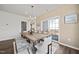 Bright dining room features a wood table with bench seating and access to a balcony at 602 Market Grove Dr # 200, Wake Forest, NC 27587