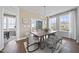 Modern dining room with hardwood floors and sliding door access to balcony at 602 Market Grove Dr # 200, Wake Forest, NC 27587