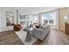 Cozy living room with fireplace and large windows offering natural light at 602 Market Grove Dr # 200, Wake Forest, NC 27587