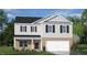 Two-story house with brick and siding exterior, a two-car garage, and landscaping at 6456 Alfalfa Ln, Wake Forest, NC 27587