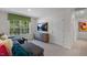 Bonus room with sectional sofa and large windows at 6460 Alfalfa Ln, Wake Forest, NC 27587
