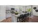 Island kitchen with stainless steel appliances and granite countertops at 6460 Alfalfa Ln, Wake Forest, NC 27587