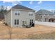 Two-story house with backyard patio, seating area, and grill at 655 Hawksbill Dr, Franklinton, NC 27525