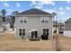 Two-story house with backyard patio, seating area, and grill at 655 Hawksbill Dr, Franklinton, NC 27525