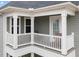 White railing balcony with two chairs and view of neighboring houses at 655 Hawksbill Dr, Franklinton, NC 27525
