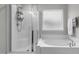 Bathroom with shower, bathtub, and updated fixtures at 655 Hawksbill Dr, Franklinton, NC 27525