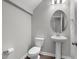 Small bathroom with pedestal sink and toilet at 655 Hawksbill Dr, Franklinton, NC 27525