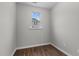 Small bedroom with wood flooring and a window at 655 Hawksbill Dr, Franklinton, NC 27525