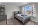 Cozy bedroom with a striped bedspread and built-in shelving at 655 Hawksbill Dr, Franklinton, NC 27525