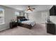 Main bedroom with ceiling fan and private balcony at 655 Hawksbill Dr, Franklinton, NC 27525