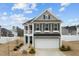 Two-story house with gray siding, balcony, and attached garage at 655 Hawksbill Dr, Franklinton, NC 27525