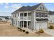 Two-story house with gray siding, balcony, and attached garage at 655 Hawksbill Dr, Franklinton, NC 27525