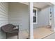 House exterior showing front porch and wicker bench at 655 Hawksbill Dr, Franklinton, NC 27525