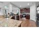 Modern kitchen with granite countertops and stainless steel appliances at 655 Hawksbill Dr, Franklinton, NC 27525