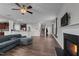 Open living room with fireplace, sectional sofa, and view of kitchen at 655 Hawksbill Dr, Franklinton, NC 27525
