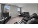 Recreation room featuring two black reclining sofas and a TV at 655 Hawksbill Dr, Franklinton, NC 27525