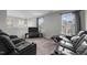 Spacious recreation room with two black reclining sofas at 655 Hawksbill Dr, Franklinton, NC 27525