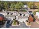 Aerial view of a three-story townhome community with parking at 7010 Sandy Forks Rd # 102, Raleigh, NC 27615