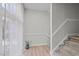 Modern staircase with light-colored wood risers and white railings at 7010 Sandy Forks Rd # 102, Raleigh, NC 27615