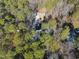 High-angle view of a house in a wooded setting near a road at 7218 Sunrise Rd, Chapel Hill, NC 27514