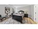 Cozy bedroom with a black bed frame and gray accents at 7218 Sunrise Rd, Chapel Hill, NC 27514