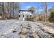 Two-story house with deck and snowy yard at 7218 Sunrise Rd, Chapel Hill, NC 27514