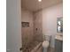 Modern bathroom with a shower, toilet, and gray vanity at 723 S Washington St, Rocky Mount, NC 27801