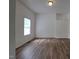 Bright bedroom featuring wood-look flooring at 723 S Washington St, Rocky Mount, NC 27801