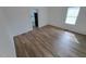 Spacious living room with wood-look floors at 723 S Washington St, Rocky Mount, NC 27801