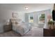 Bright bedroom with large windows and neutral decor at 86 Macy Cir, Wendell, NC 27591