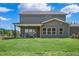 Gray house exterior with covered patio and yard at 86 Macy Cir, Wendell, NC 27591