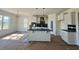 Modern kitchen featuring a center island, stainless steel appliances, and white cabinets at 899 Olive Branch Dr, Smithfield, NC 27577