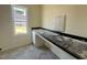 Functional laundry room with ample counter space, storage, and a window for natural light at 899 Olive Branch Dr, Smithfield, NC 27577