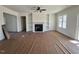 Spacious living room with fireplace, built-in shelving, and large windows offering plenty of natural light at 899 Olive Branch Dr, Smithfield, NC 27577