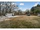 Spacious backyard with shed and partially snow covered grass at 927 Bellvue St, Burlington, NC 27217